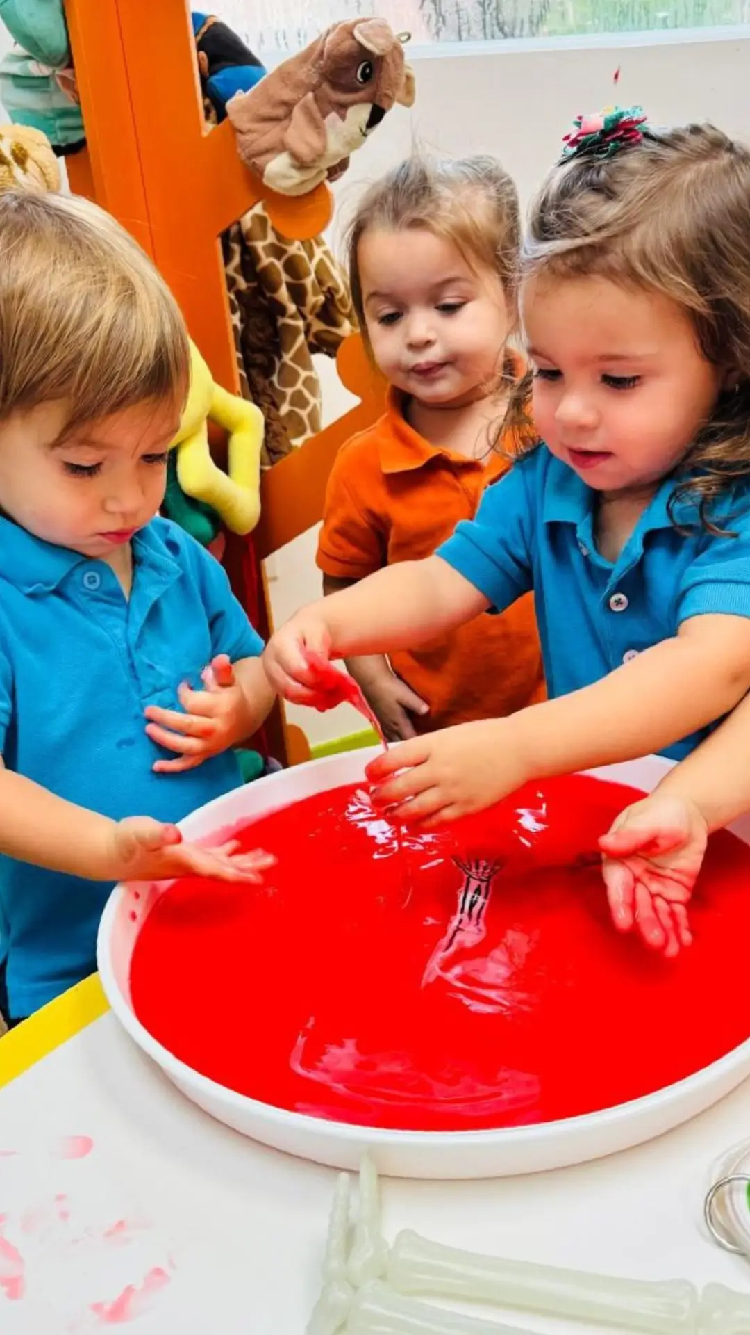 Preschool children in a classroom sensory play activity at Pines West Academy
